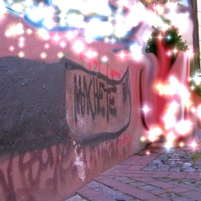 Graffiti and street art from a photo tour in Bremen including colourful sprayed tags and top-to-bottoms.