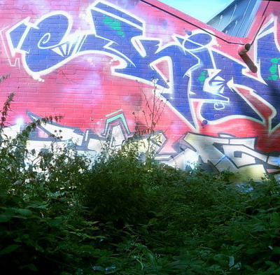 Graffiti and street art from a photo tour in Bremen including colourful sprayed tags and top-to-bottoms.