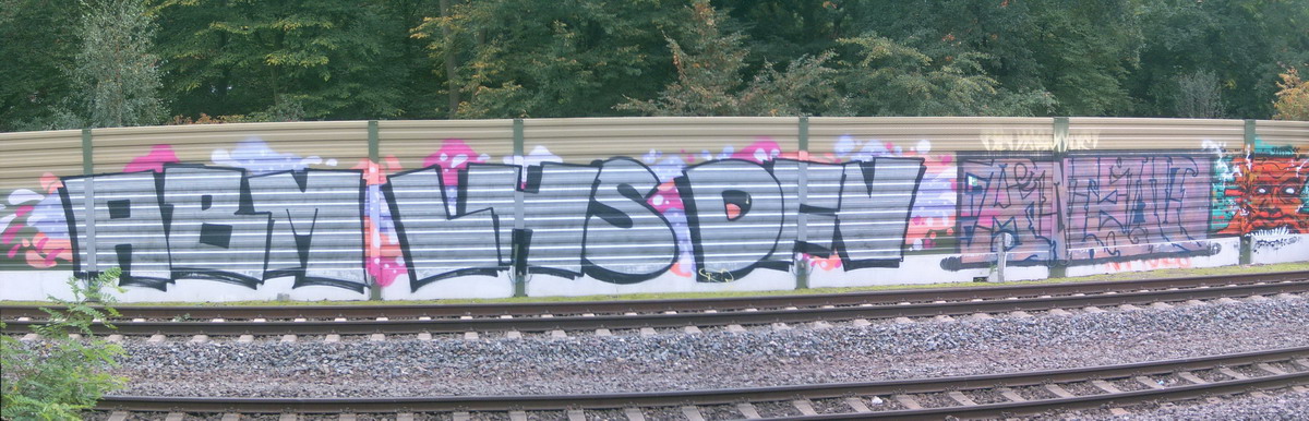 Graffiti and street art from a photo tour in Bremen including colourful sprayed tags and top-to-bottoms.