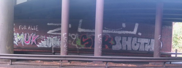 Graffiti and street art from a photo tour in Bremen including colourful sprayed tags and top-to-bottoms.