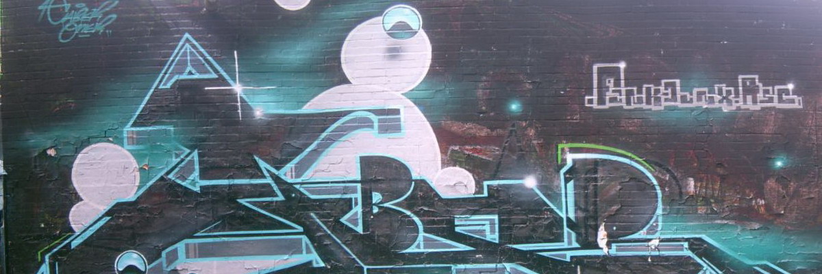Graffiti and street art from a photo tour in Bremen including colourful sprayed tags and top-to-bottoms.