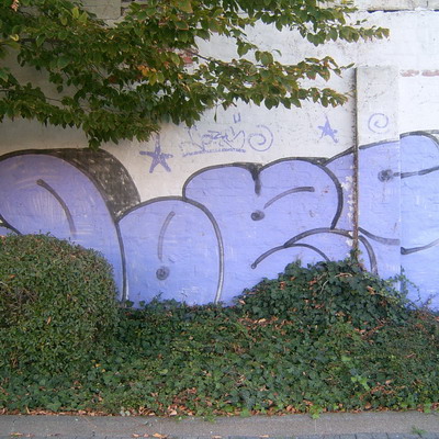 Graffiti and street art from a photo tour in Bremen including colourful sprayed tags and top-to-bottoms.