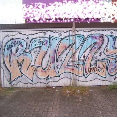 Graffiti and street art from a photo tour in Bremen including colourful sprayed tags and top-to-bottoms.