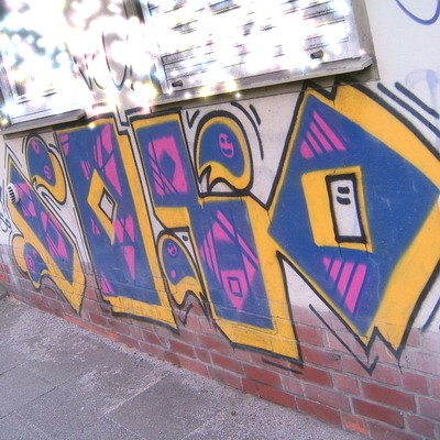 Graffiti and street art from a photo tour in Bremen including colourful sprayed tags and top-to-bottoms.